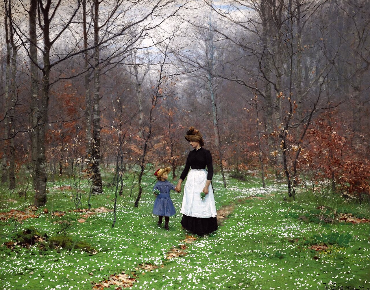 Mother walking outside with a small child.