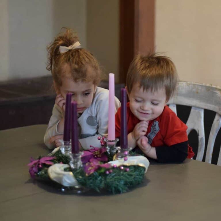 kids looking at advent wreath
