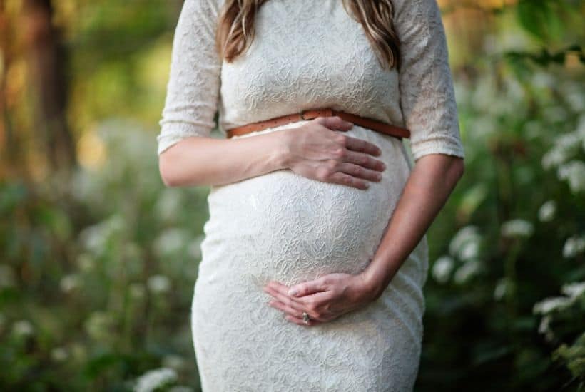 pregnant lady in a white dress