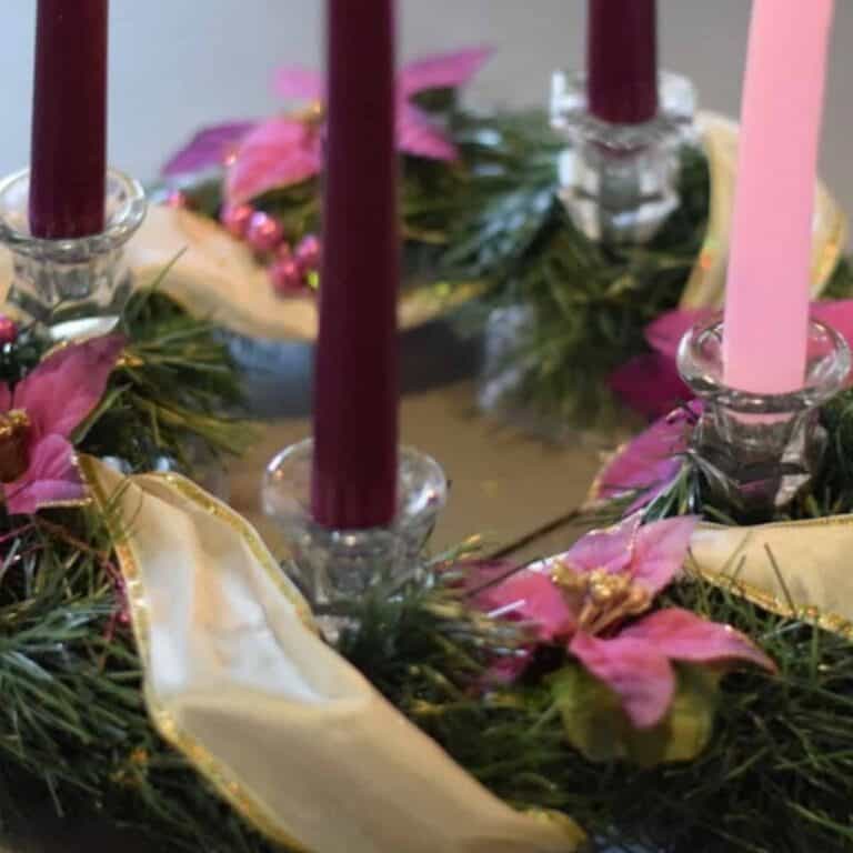 close up image of homemade advent wreath with candles