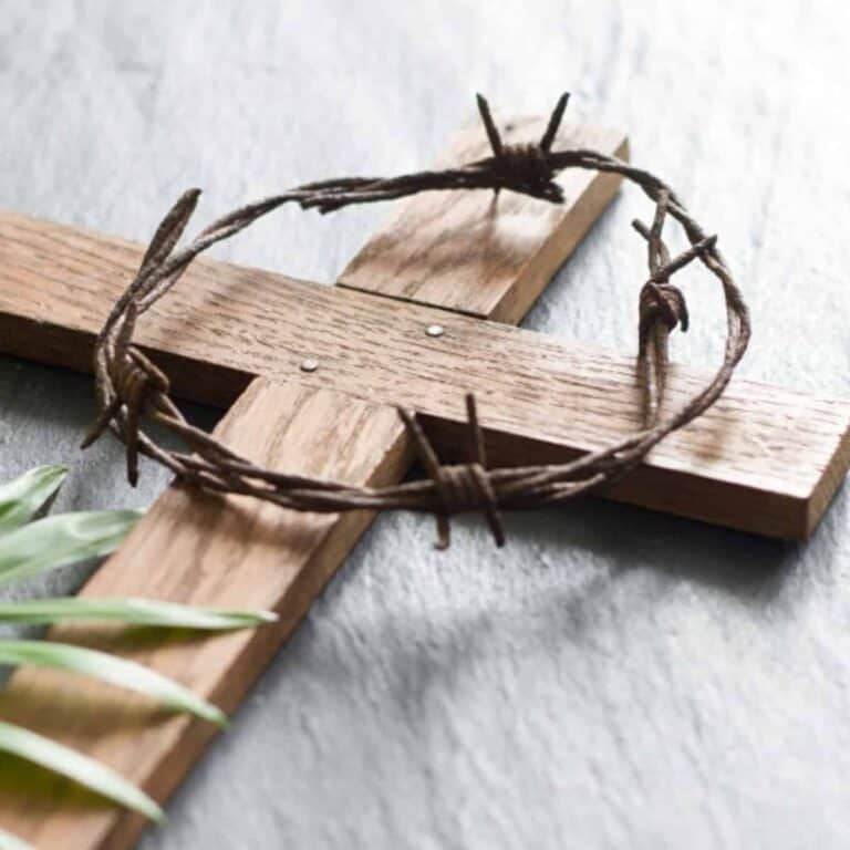 wooden cross with a crown of thorns