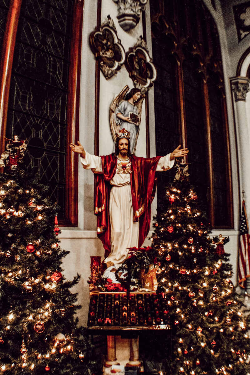Sacred Heart of Jesus statue decorated at Christmas time