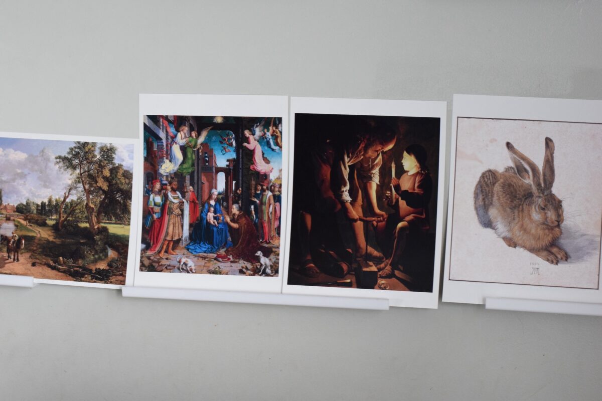 Kinderleben artist set of prints on a wall shelf.