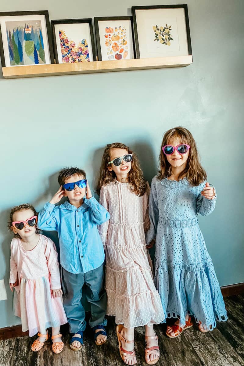 kids in their easter outfits and wearing sunglasses