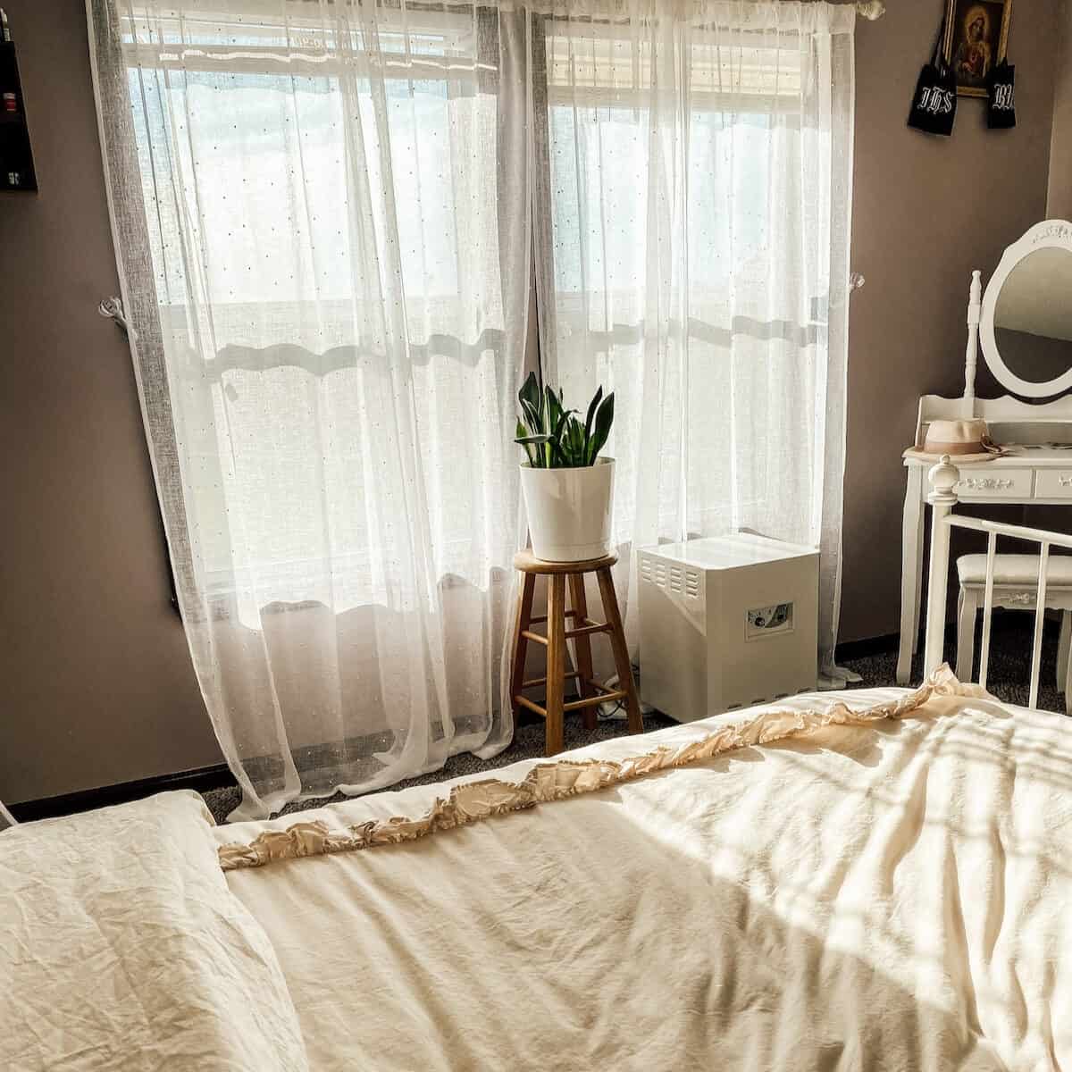 window view and small white vanity in the bedroom