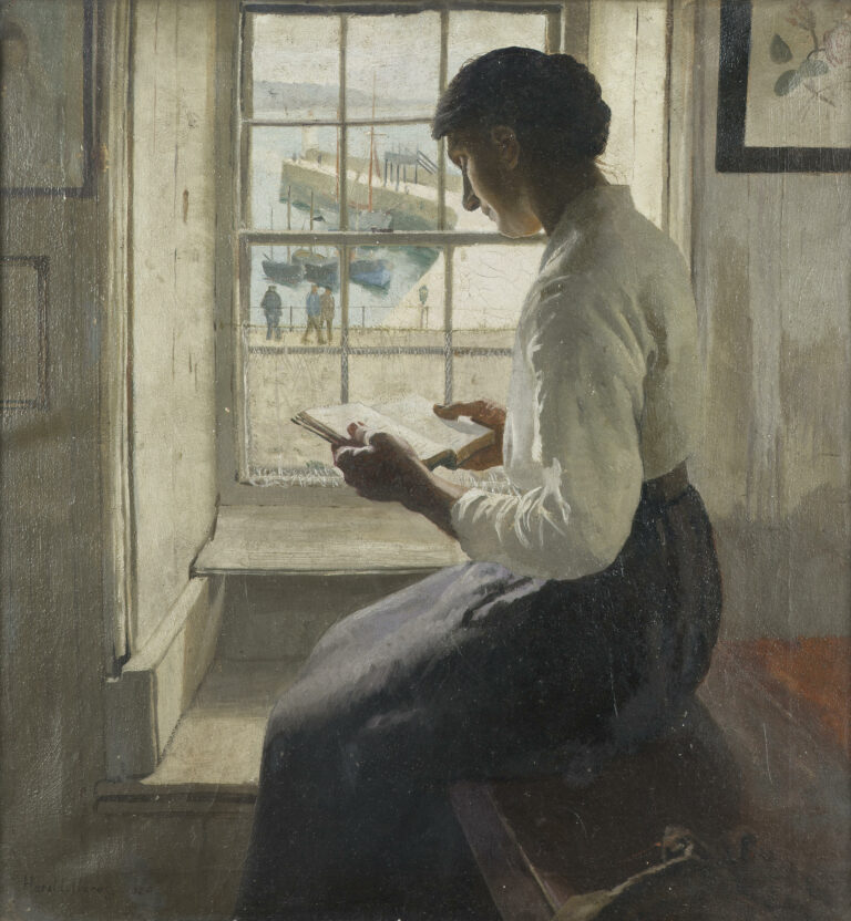 a lady reading a book while sitting by the window.