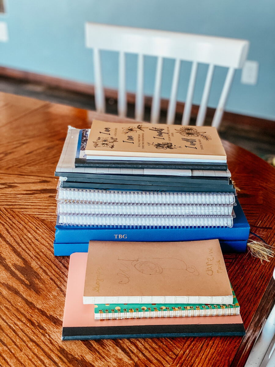 stack of notebooks on the dining table. 