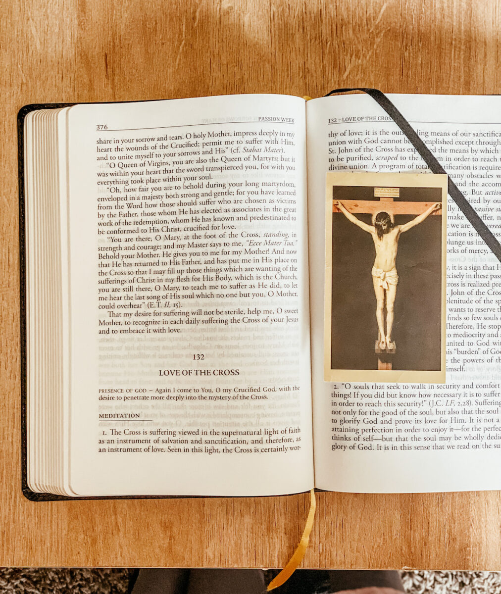 divine intimacy prayer book with a holy card of the crucifixion.