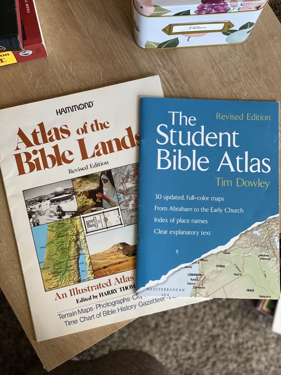 bible study student atlas books on a table. 