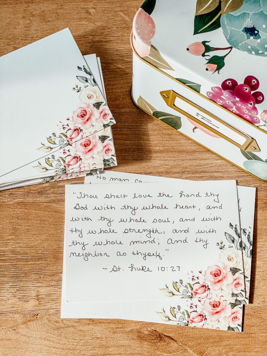 scripture verses written on floral index cards with a flower recipe box. 