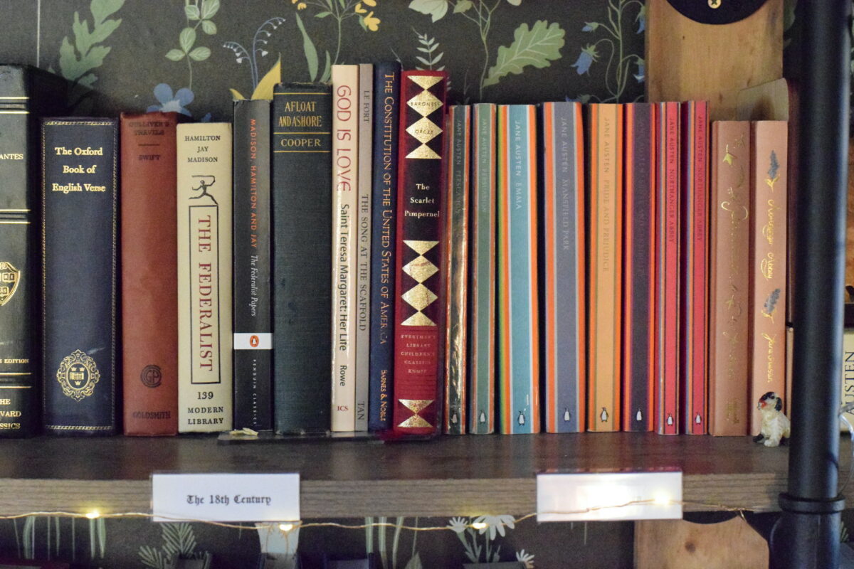 books from the 18th century and Jane Austen books on a book shelf in the home library. 