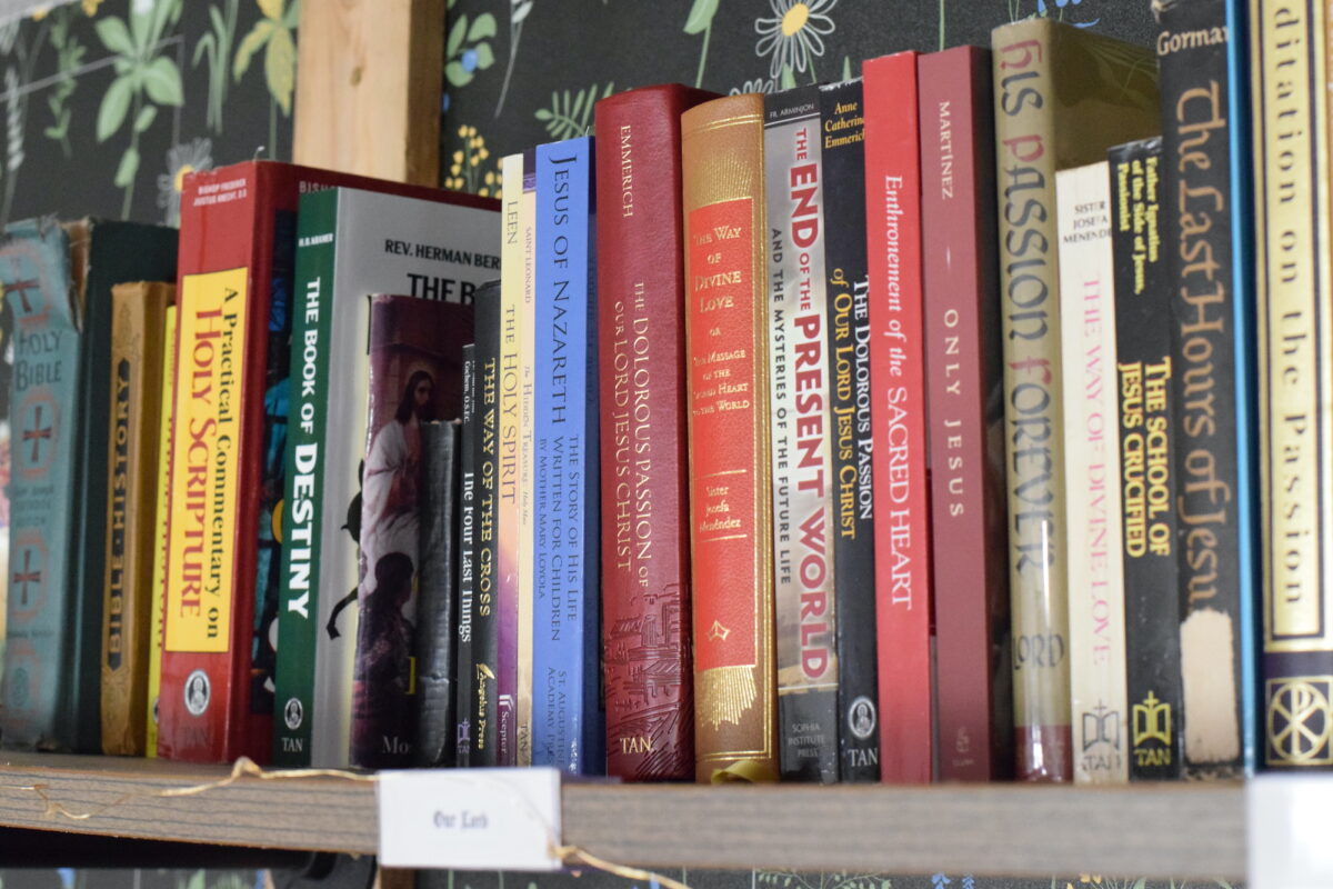 books of Our Lord and Holy Scripture on a book shelf. 