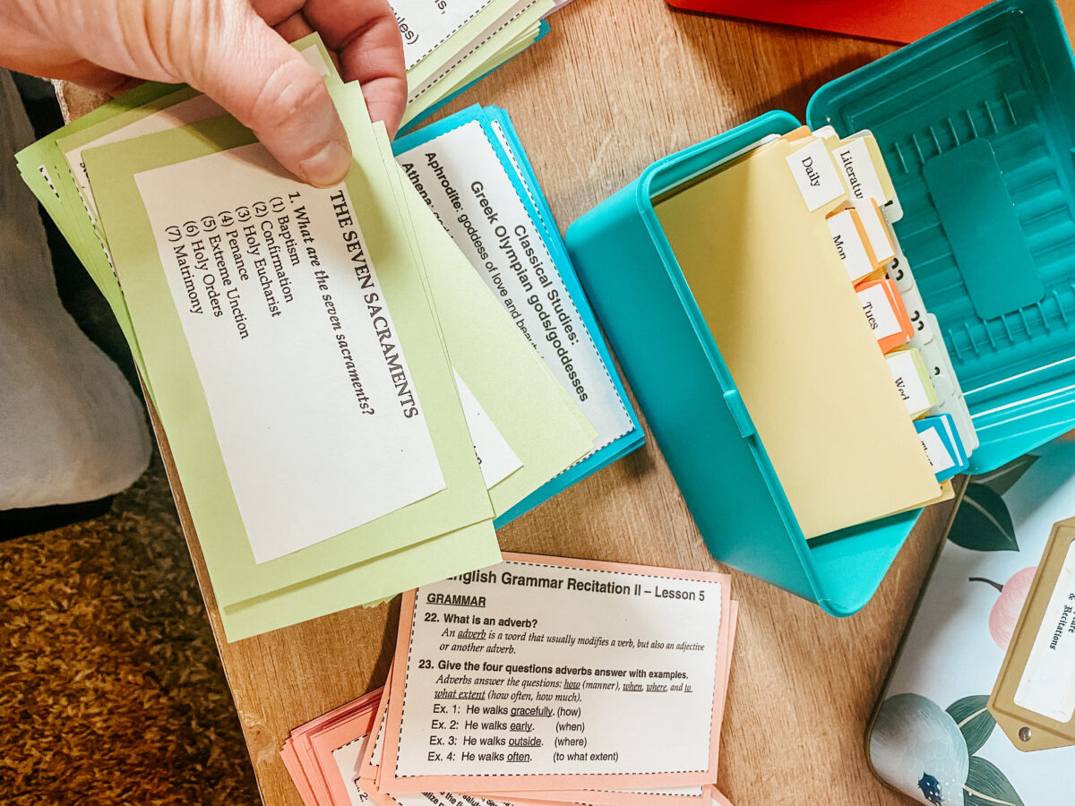 color coded flash cards and memory verses and tabs on a table.