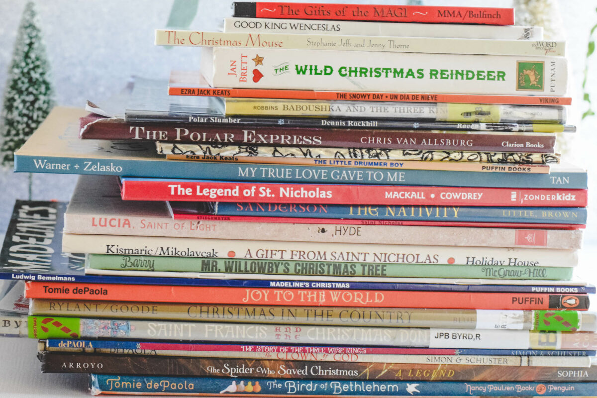 Stack of Christmas picture books on the table. 