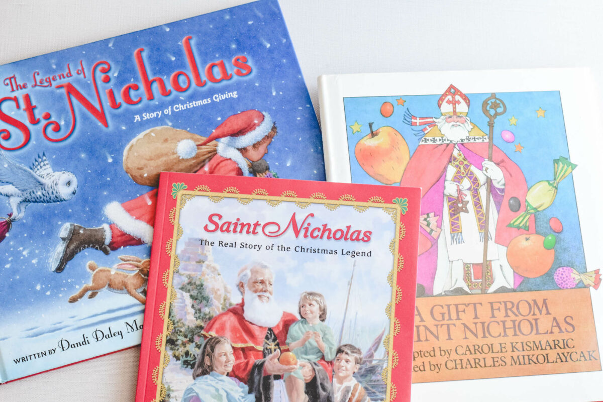 stack of St. Nicholas picture books on a table. 