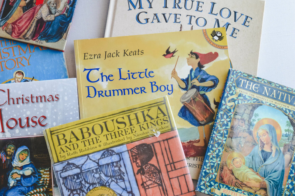 Stack of a variety Christmas picture books on the table. 