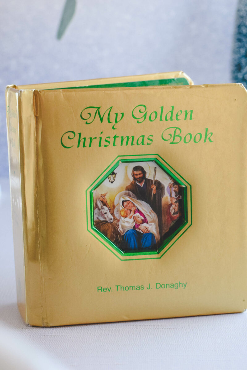 My Golden Christmas Book standing up on a table top. 