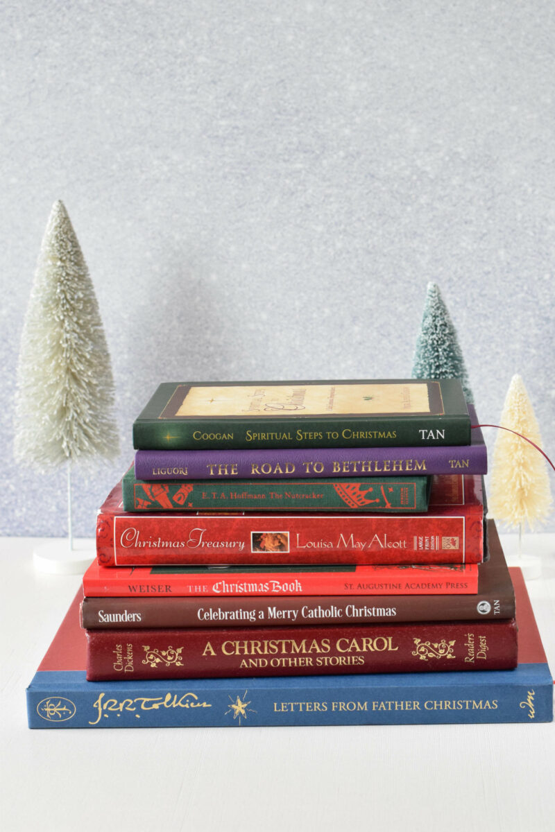 stack of christmas read aloud books on a table.