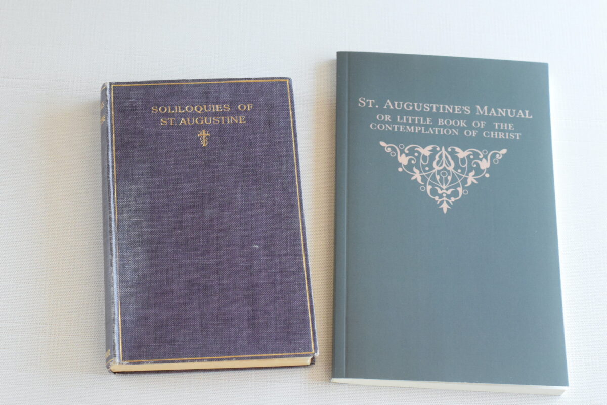 stack of vintage prayer books on a table.