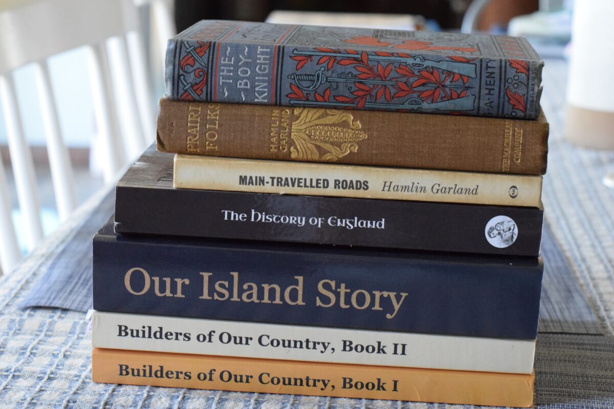 year 4 history books stacked on a table. 