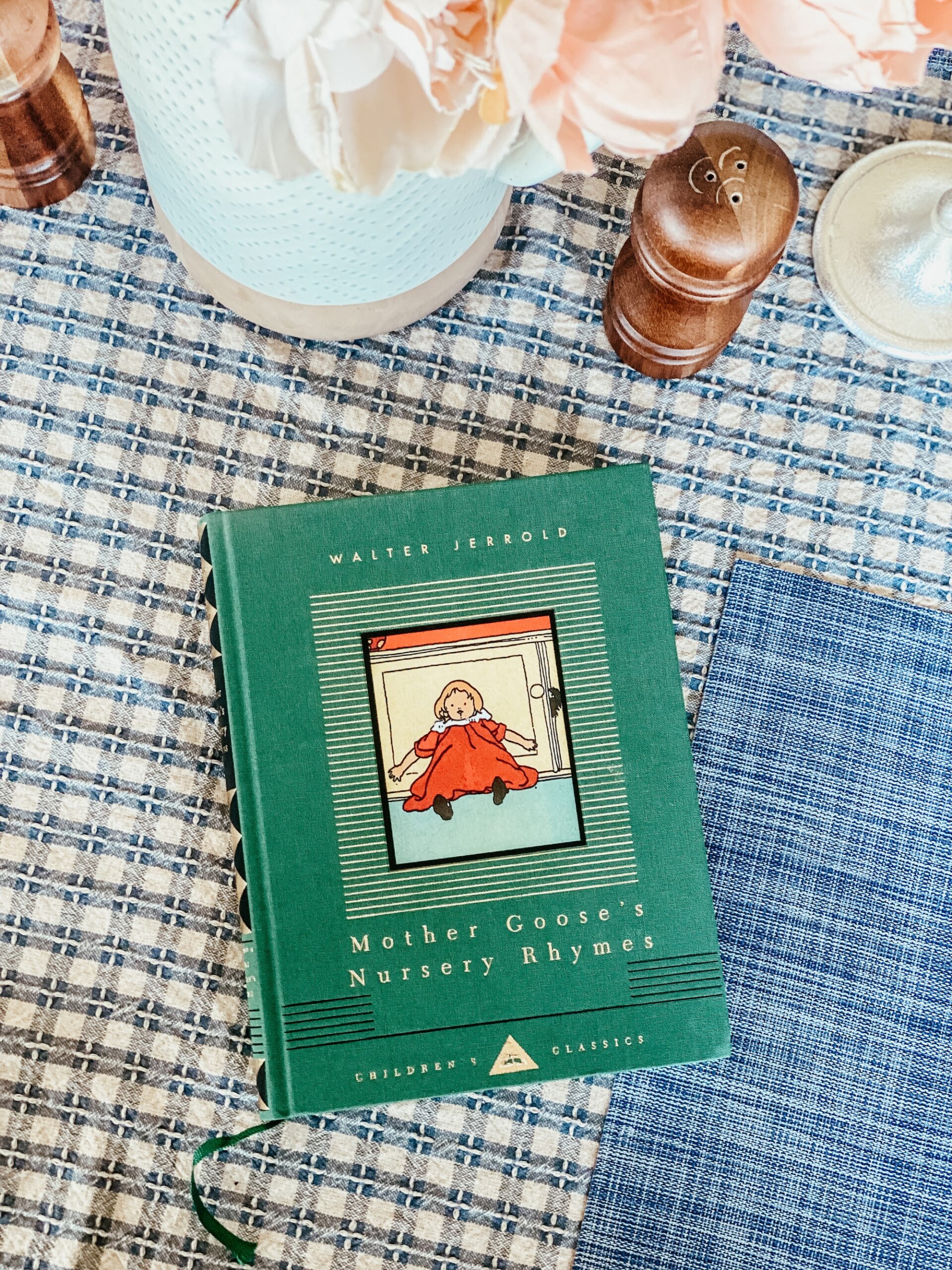 Mother Goose book on a dining table.
