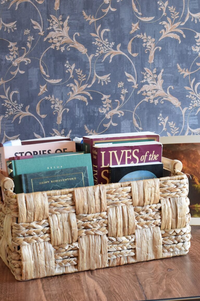 basket filled with living books on a table.
