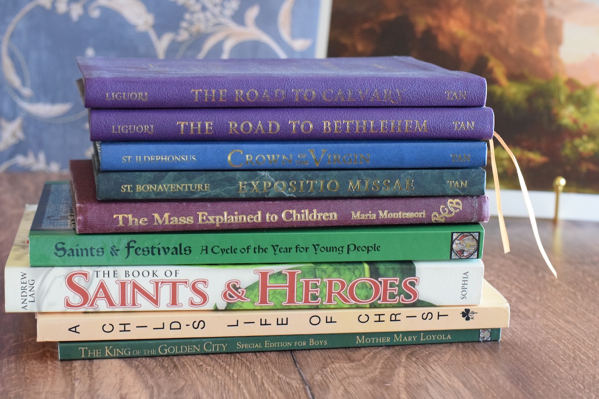 devotional books stacked on a table.