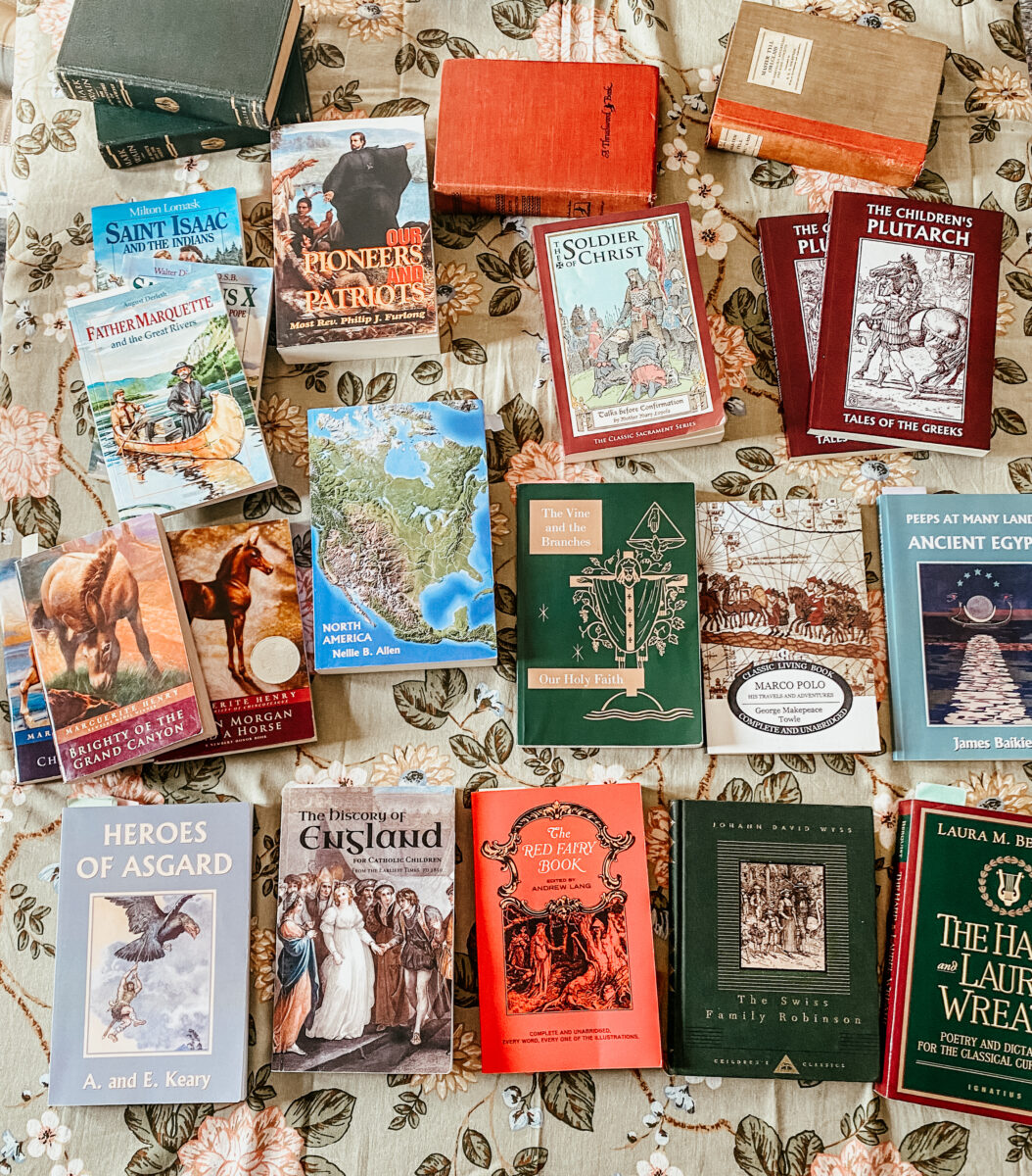 school books for year 4 spread on a dining table. 