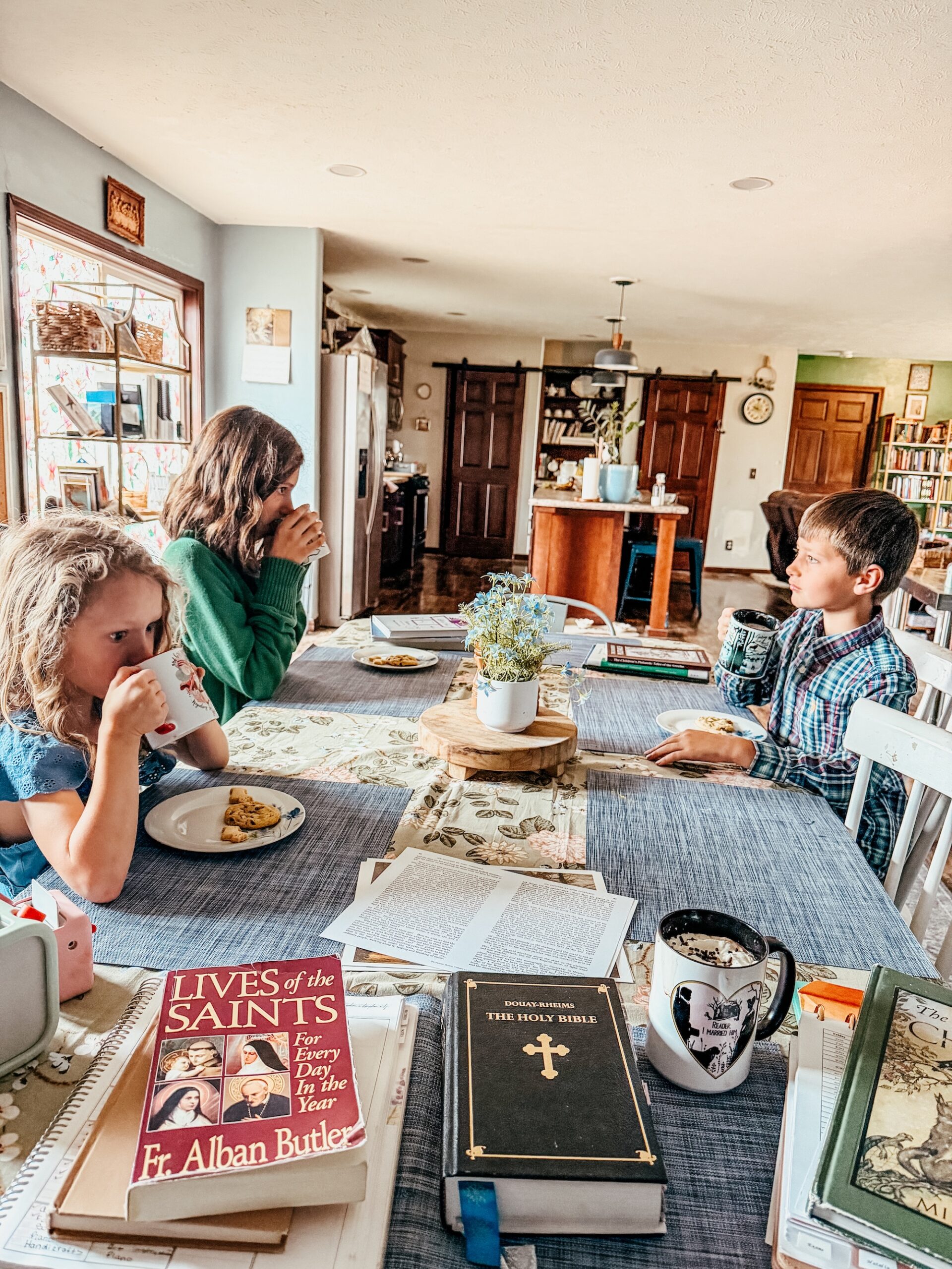 children at the table during tea time for morning lessons.
