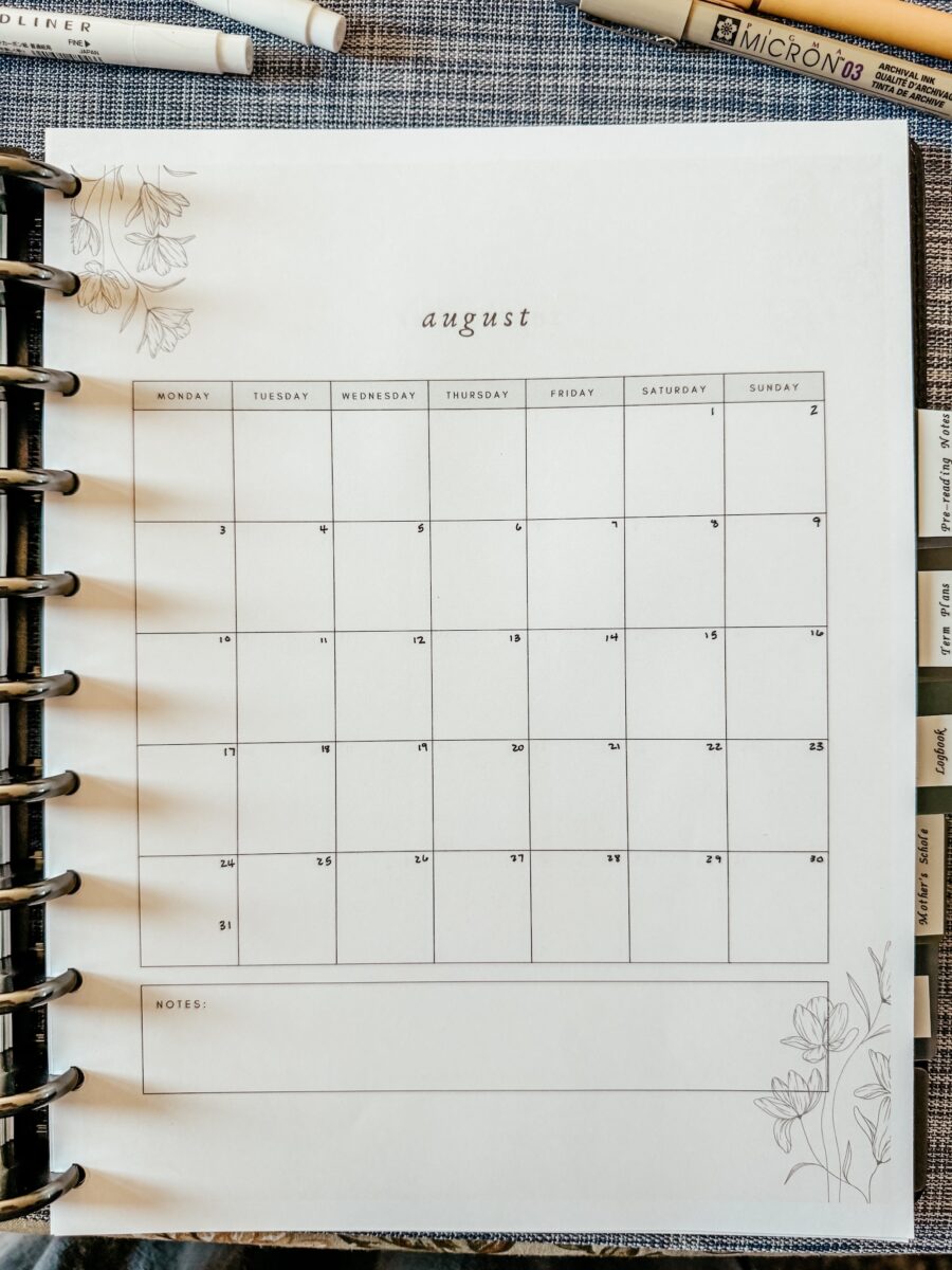 monthly planner page for August inside of the planner. 