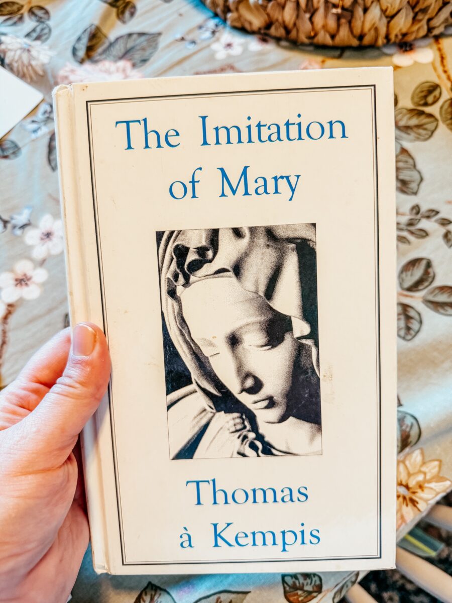The Imitation of Mary book on a table. 