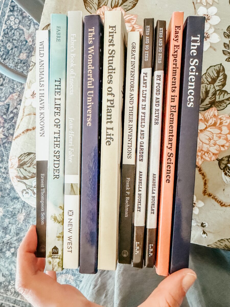 nature and science books on a table.